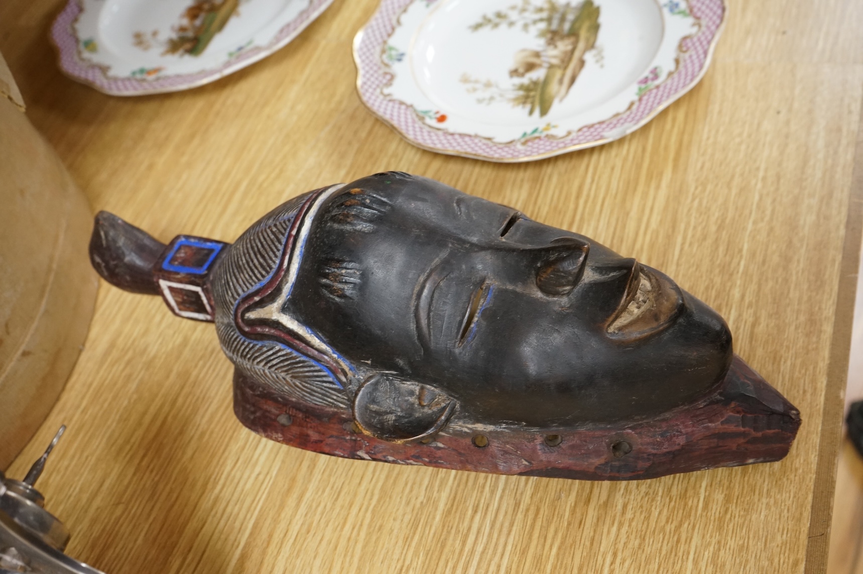 A carved African Ivory Coast mask, 39cm high